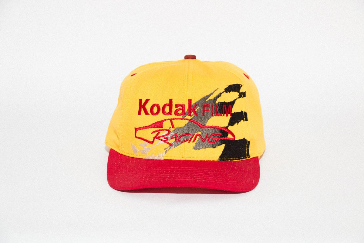 Vintage Kodak Film Racing Team snapback, yellow crown and red brim, front view