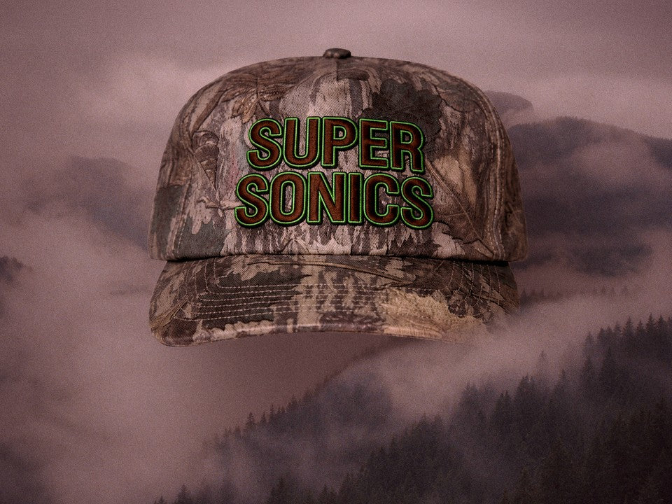 Super Sonics cap in foggy mountains